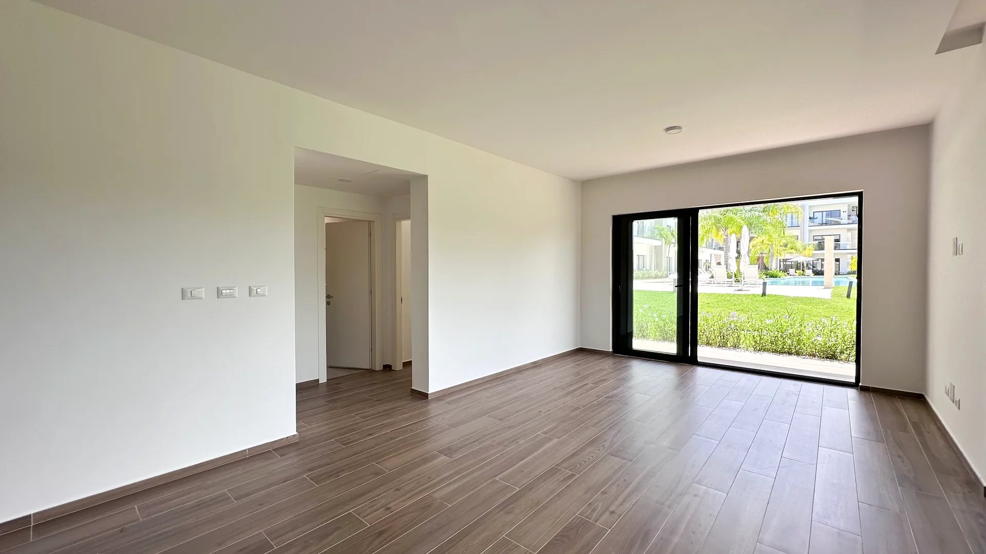 Cana Cove · Garden Residence A-101 — Spacious living-dining room