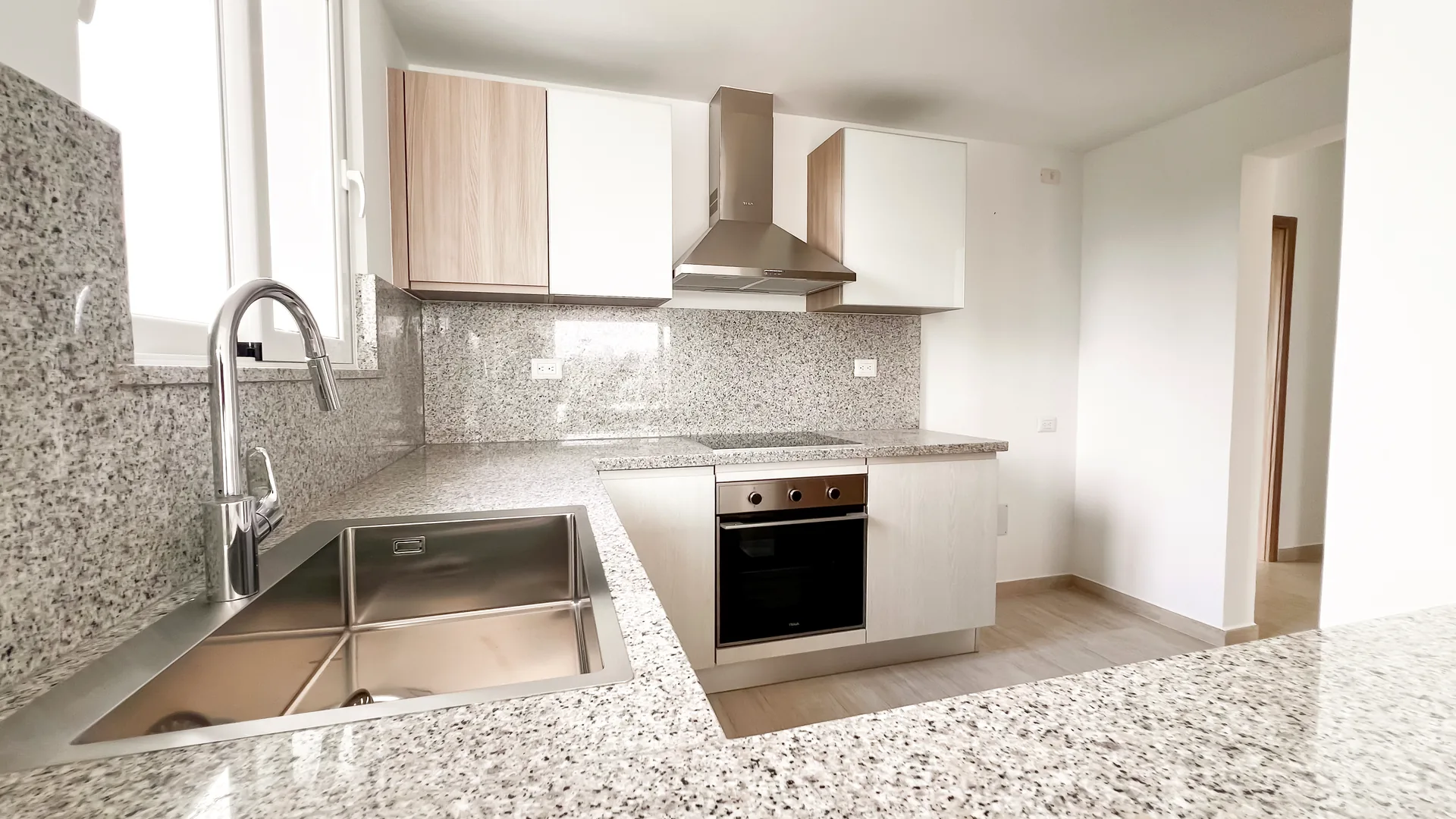 Cana Pearl · Rooftop Residence N-302 — Kitchen with granite worktops and stainless sink