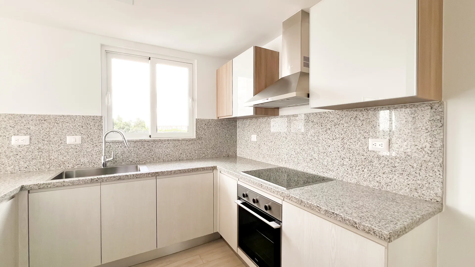 Cana Pearl · Rooftop Residence N-302 — Fitted kitchen with oven, hob and extractor hood