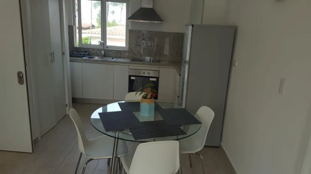 Coral Village · Apartment B-3-B — Kitchen and dining area