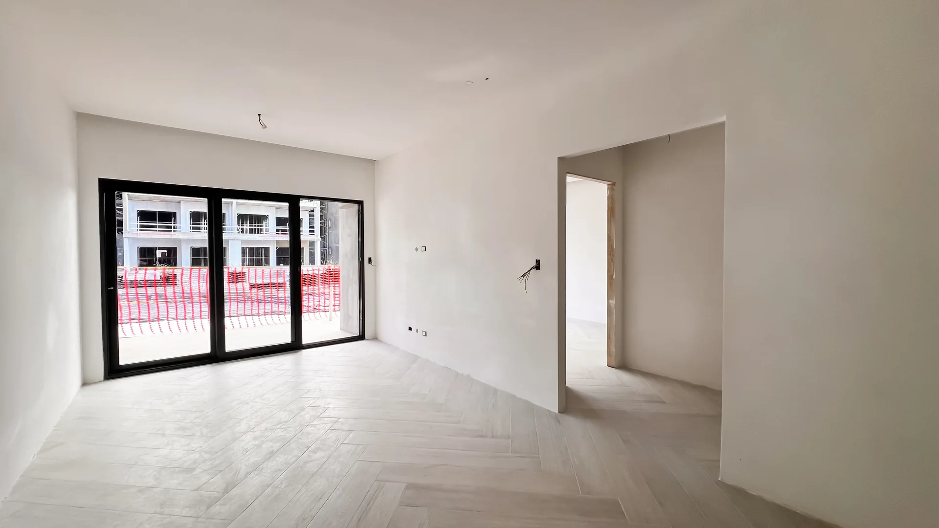 Oceana by Noval — Construction progress: living room with herringbone floor